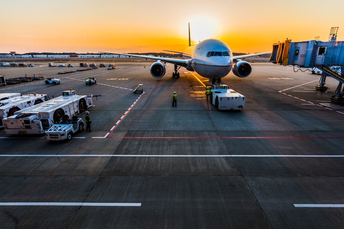 Chauffeur at airport with name placard